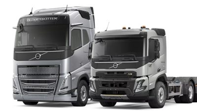 Two Volvo trucks shown side by side on a white background.