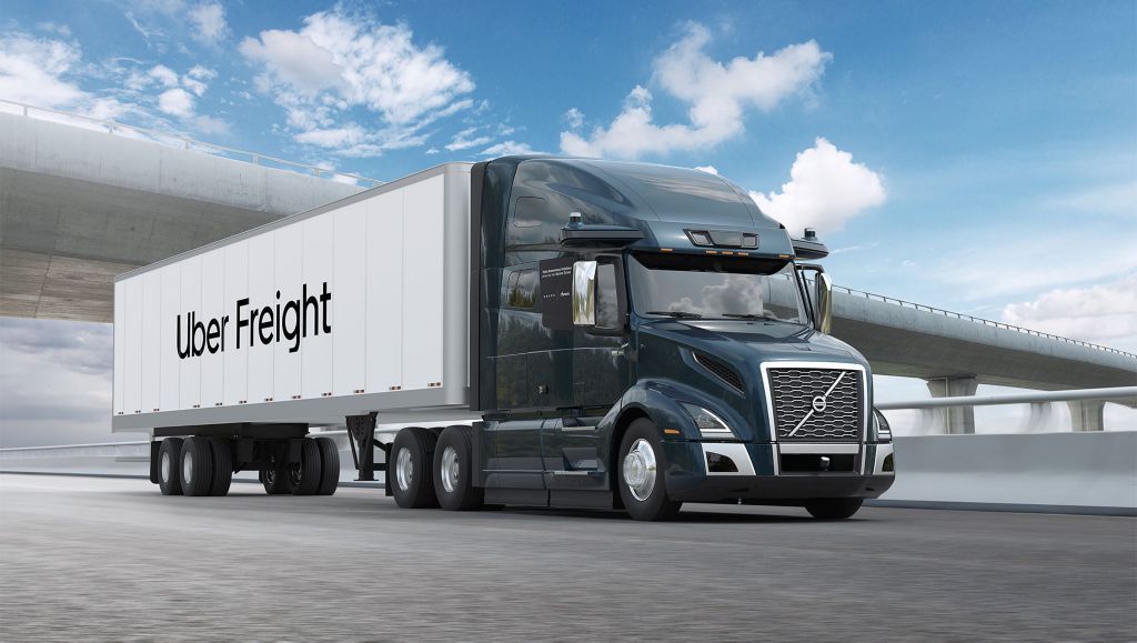 Volvo VNL Truck with Uber Freight trailer driving on highway