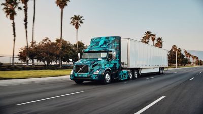 Turquoise and white Volvo truck