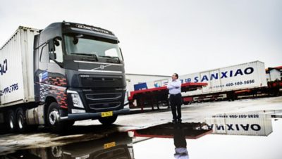 Zhou Zhili with a Volvo truck.