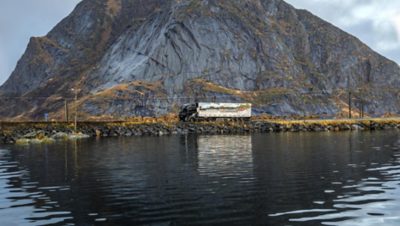 Truck on narrow road in Lofoten.