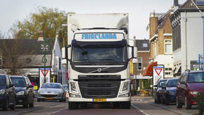 Frigolanda truck in city street.