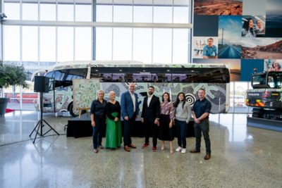 The Volvo Bus Australia Queensland team with Goreng Goreng Artist, Jacob Sarra. 