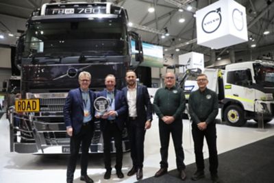 Volvo Group Australia Accept the Award from ToYA in front of the FH16 780 at Brisbane Truck Show  - Credit: NZ Trucking Magazine