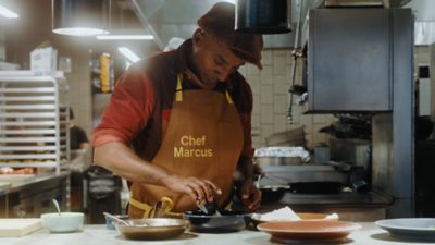 Marcus Samuelsson standing by a bridge in Gothenburg