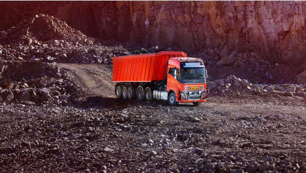 Red Volvo autonomous truck in a quarry in Brönnöy