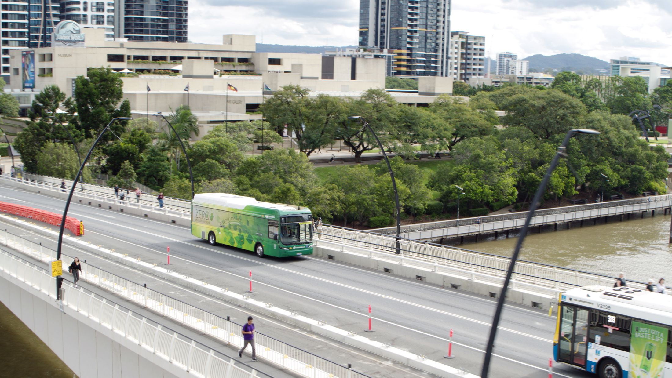 Aerial view of a bridge in Brisbane with a green electric Volvo BZL.