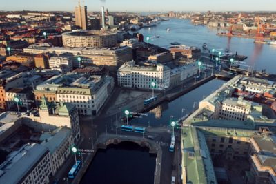 Bird’s view of a city with buses transmitting data