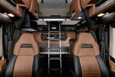 Mack Trucks is elevating the standard for driver comfort with its new Pioneer Series, featuring an exclusive FlexSuite system that allows the lower bunk to be rotated up against the rear wall, creating substantial standing room for dressing and movement. This easy-to-use system requires just three clicks to transform the space—rotating the mattress up and unfolding the seats and table.