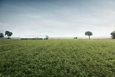Volvo FH LNG driving along fields