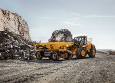 Volvo TA15 and a excavator working in a quarry