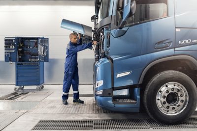 Technician walking beside FMX truck