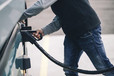 Man charging truck at a charging station