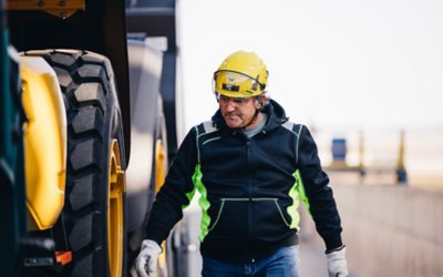 Worker walking on the side of the truck