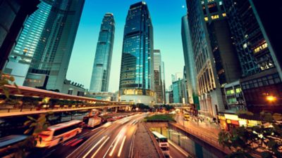 Panoramic view of a large city with skyscrapers and heavily trafficked roads