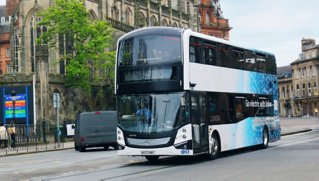 A Volvo BZL Electric double-decker in city traffic