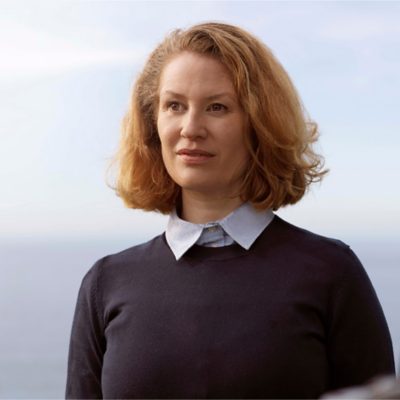 A female coach driver with red hair