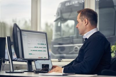 Driver pointing on screen inside cab