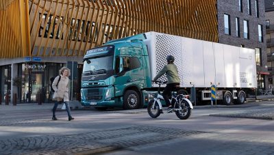 The Volvo FM Electric delivering in a city