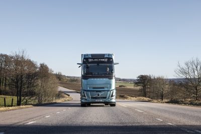 Volvo FH Aero Electric driving on road, viewed from the front 