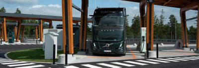 Black Volvo Truck charging at a charging station