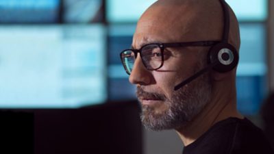 A fleet manager monitoring the fleet from an office
