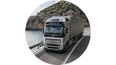 A Volvo FH drives on a bridge over water