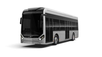 An image showing the darkened front of the GML Eco Range City bus with the headlights fully lit.