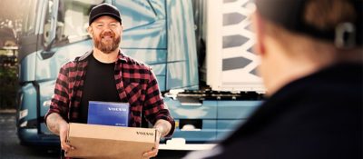 A driver delivers a Genuine Volvo Part to a customer