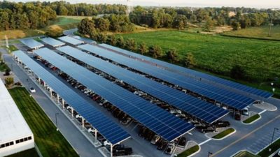 Cars parked under solar roof