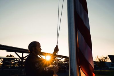 Volvo employee hoist US flag