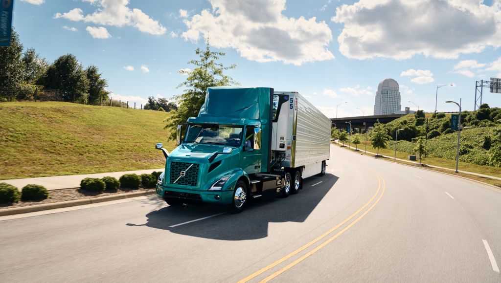Volvo truck driving on an empty street in the sun | Volvo Group
