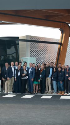 Group of people in front of Volvo Truck