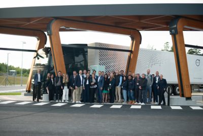 Group of people in front of Volvo Truck