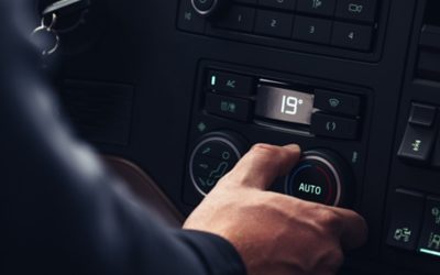 Driver adjusting temperature in the cab