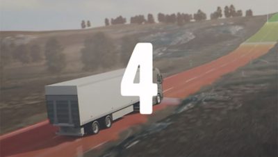 Een CGI van een truck die rijdt op een weg die van rood naar groen gekleurd is.