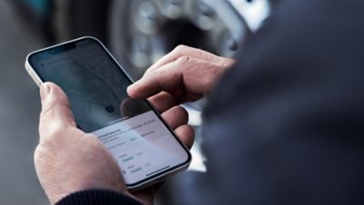 Man holding smartphone in hand