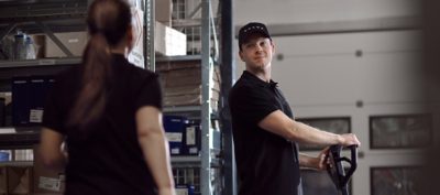 Man and woman at work in a Volvo workshop