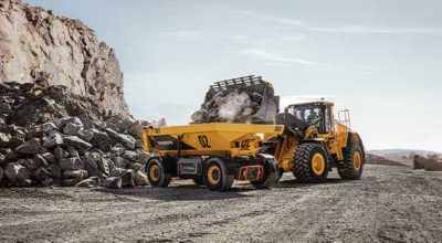  Volvo TA15 and a excavator working in a quarry