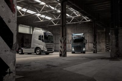 Volvo FM and Volvo FH inside a shed with mood lighting