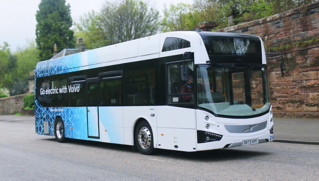 A Volvo BZL Electric in a countryside lane