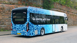 A Volvo BZL Electric in a countryside lane