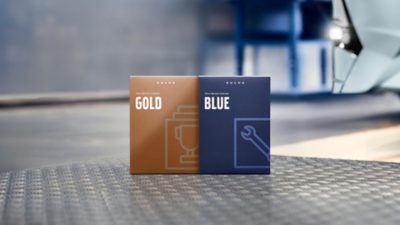 A line-up boxes with print, showing the range of service contracts: Gold Contract and Blue Contract.