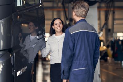 Technician and owner talking 