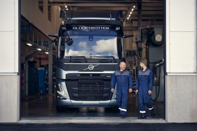 Technicians walking beside truck