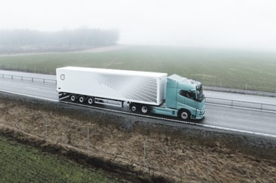 Blue electric truck on the road