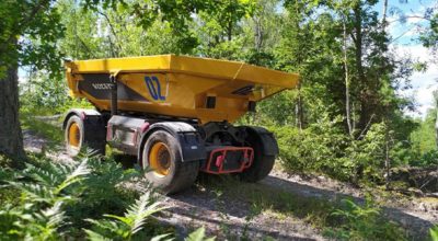 Volvo TA15 electric dumper driving on a forest road