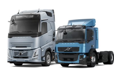 Illustrazione di due camion Volvo FH Aero alimentato a gas e FE CNG, posizionati l’uno al lato dell’altro su uno sfondo pulito.