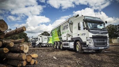 AMP Clean Energy has put two new Volvo FM 8x2 Tridem 32-tonne rigids into operation, fitted with the first UK-supplied, Transmanut 31 cubic metre bulk transport bodies featuring dust extraction equipment.