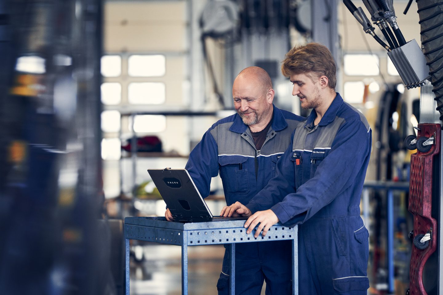 Technicians working by a laptop